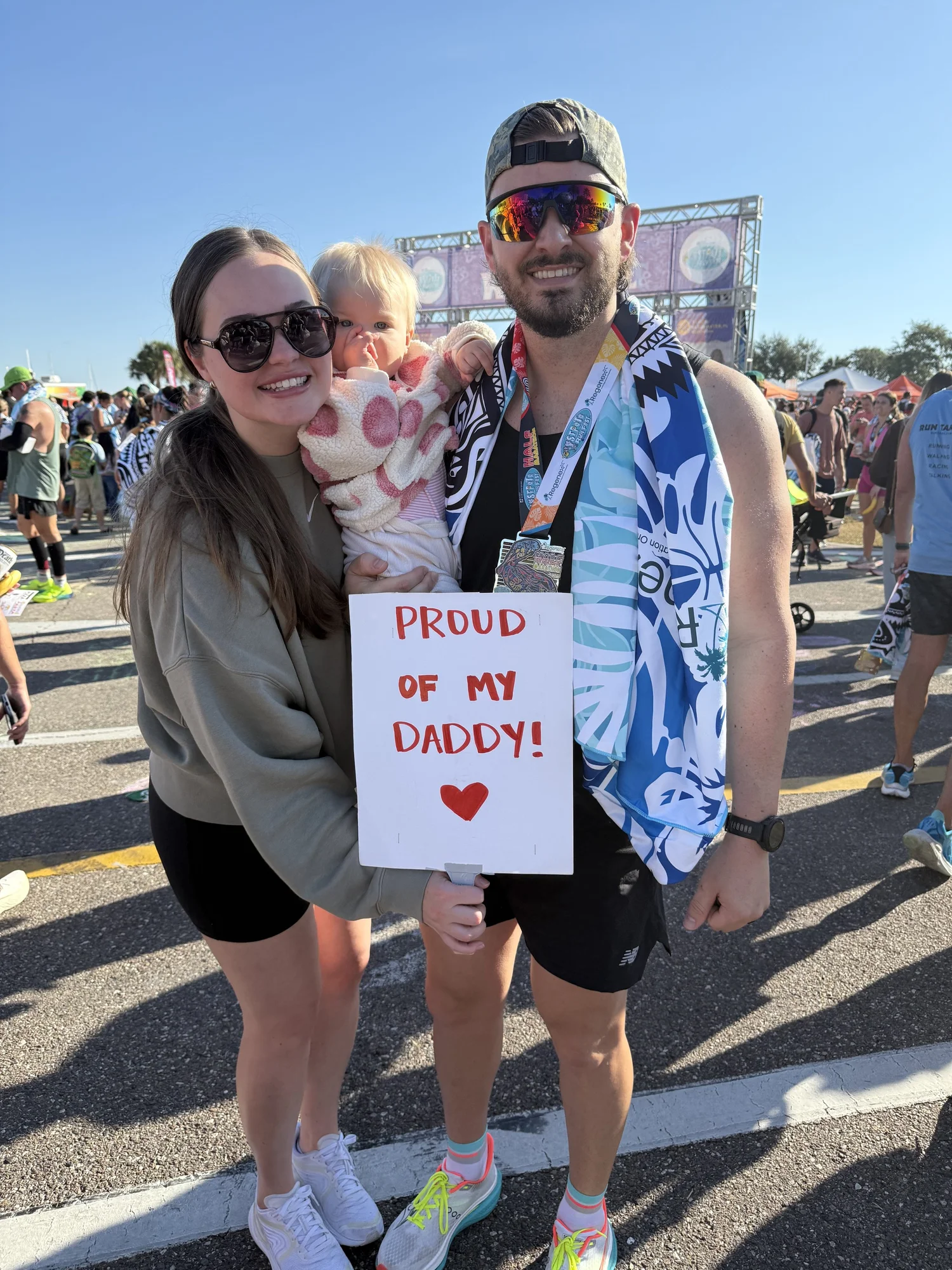 Mitch with his wife Reba and daughter Olivia at the finish of his first half marathon